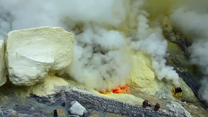 Close view on sulfur mine and acid crater lake at Ijen crater. East Java, Indonesia.