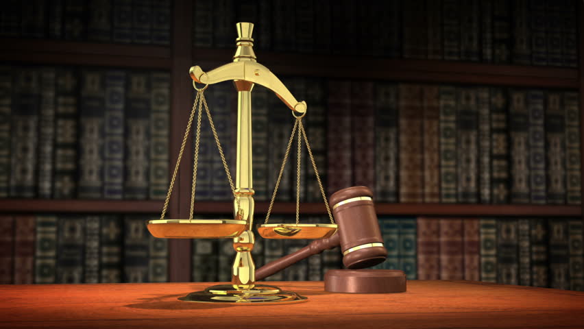 1080p HD Stock Video of a gavel and Scales of Justice on a desk with a slow camera pan.
