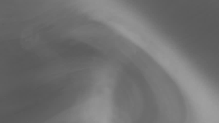 Thin tendrils of misty, smoky vapor cling to the water surface and undulate like rippled waves. Great background, smoke, or fog effects. Fifteen second loop.