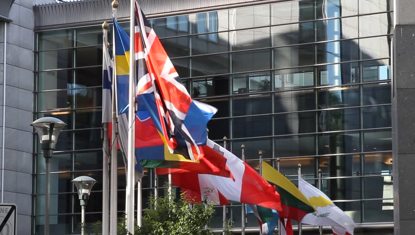 Flags of European Countries floating in front of the European Parliament building in Brussels