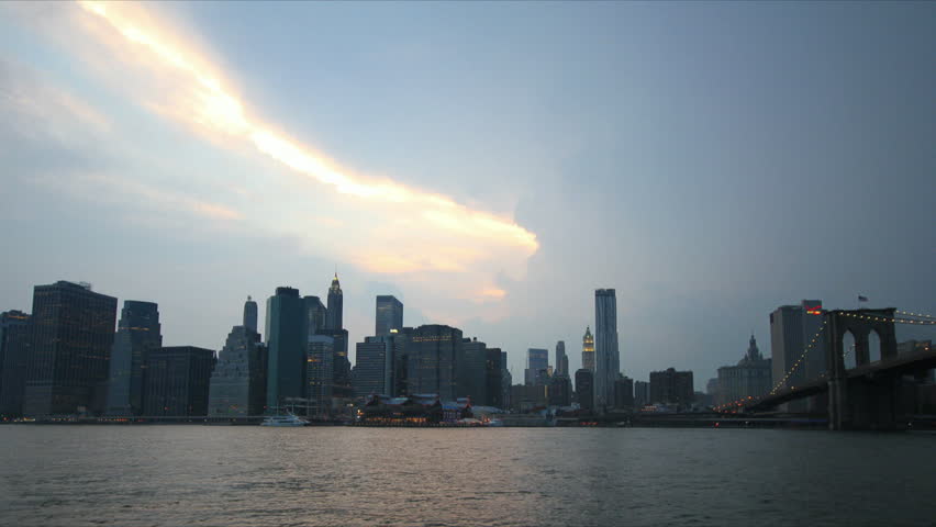 Time-lapse of New York City Skyline (south street seaport) at stormy weather, from dusk to night