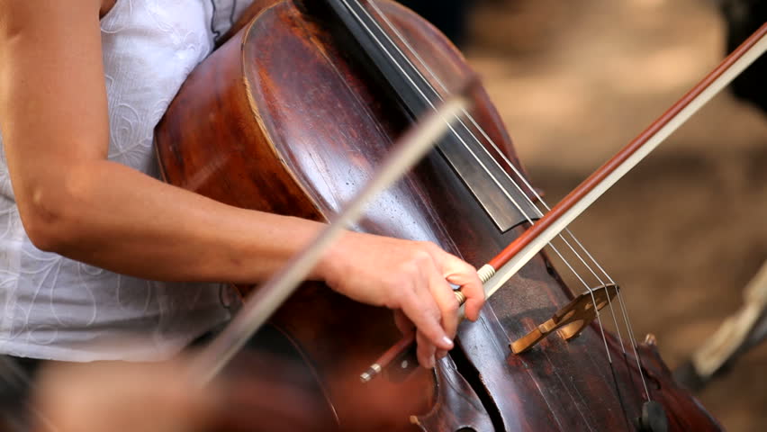 Cellist. Professional musicians playing cello in the symphony orchestra.