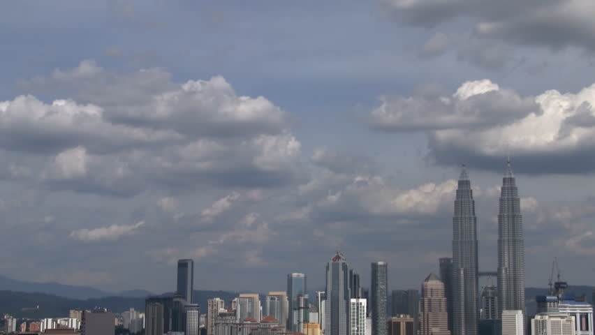 Time-lapse of Kuala Lumpur skyline with cloudy sky