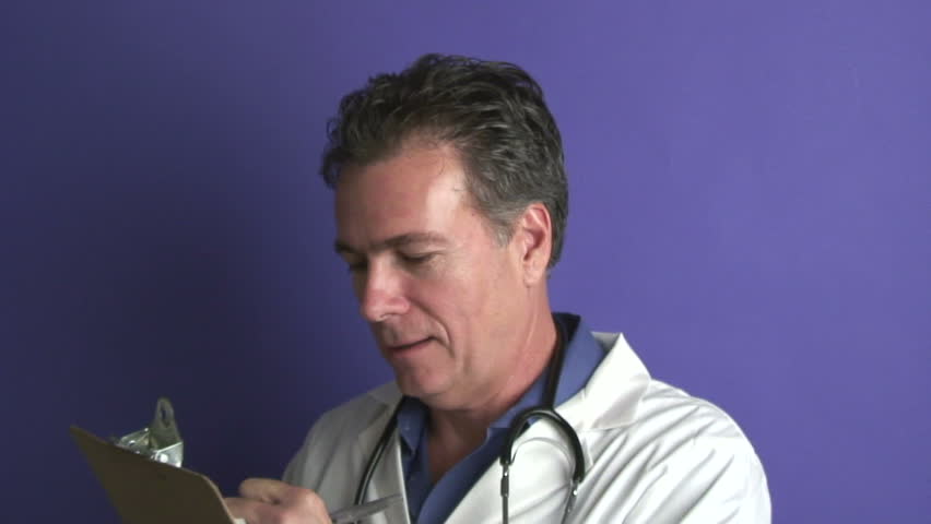 A doctor taking notes from a patient and then using moving the  stethoscope toward the camera.