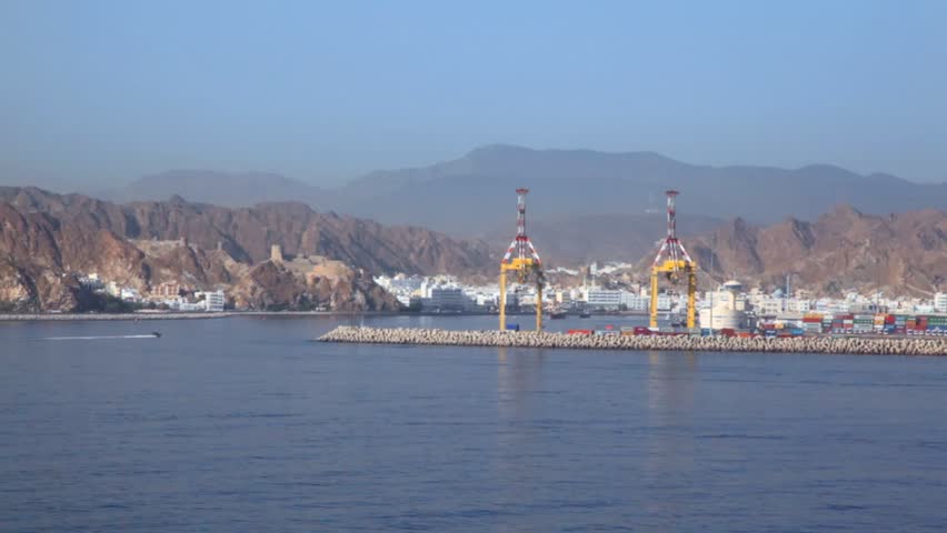 view from ship moving pass by seaport of Muscat, Oman