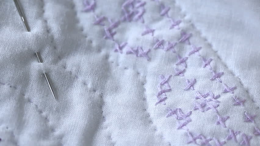 Needle work: embroidery, cross stitch, quilting. Hand sewing with needle and thread, close up in HD.  Edited with a community sewing class or group in mind.  Copy space available. 