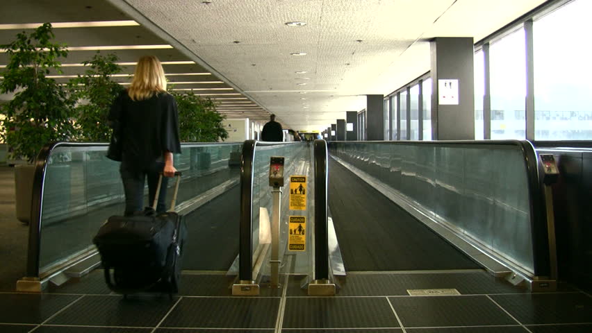People on a moving walkway at the airport