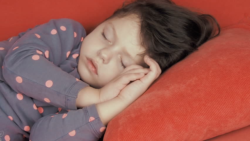 Sleeping Child A Beautiful Little Girl Fell Asleep On The Couch