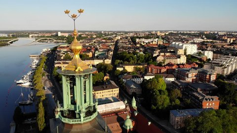 Aerial view, panning side ways, of the Stockholm City Hall "Stadshuset" and its surroundings.