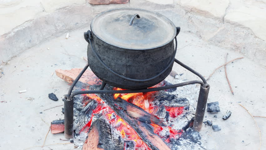 Fire Burning In A Pit To Cook Potjiekos In A Classic South African