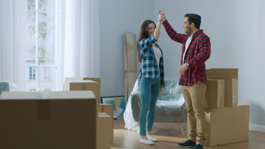 Hy Young Moving In Stock Footage Video 100 Royalty Hy Young Moving In Into New Apartment Carrying Cardboard Boxes With Stuff Having Fun And Hugging Boyfriend Friend Start Living