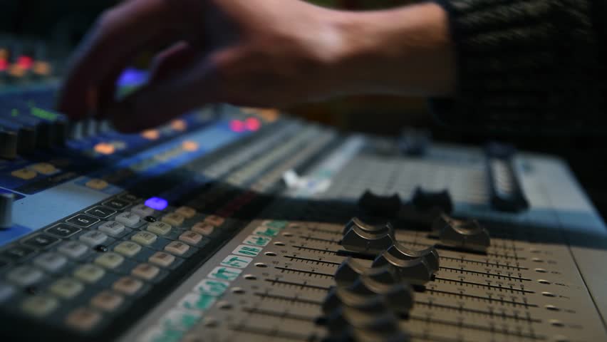 Mixing Music On A Recording Studio Mixing Desk