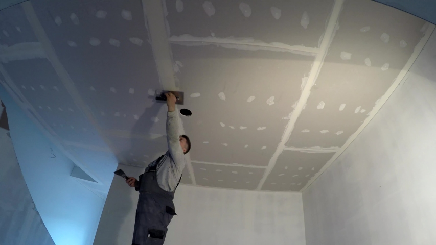 Plasterer Man Spackling Ceiling Sheet Stock Footage Video 100