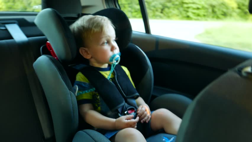Baby Kid In The Children S Car Seat In The Car Rides Little Baby Kid In