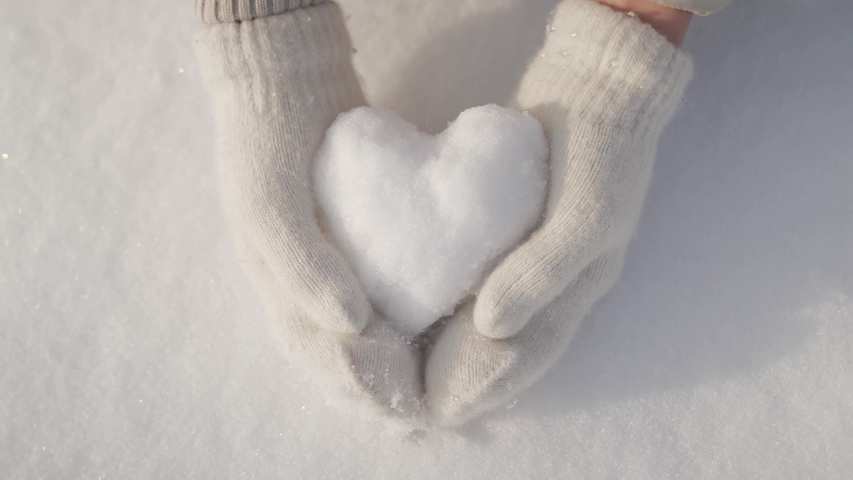 Hand holding White Snow in Heart shape image - Free stock photo ...