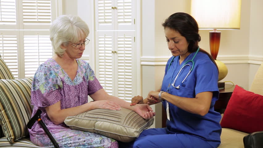 The nurse assesses the patient's pulse.