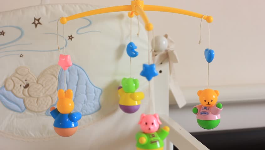 spinning baby toys above crib