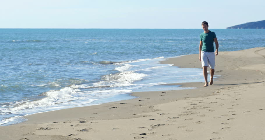 Man Walking On The Beach Stock Footage Video 100 Royalty Free Browse Video Categories