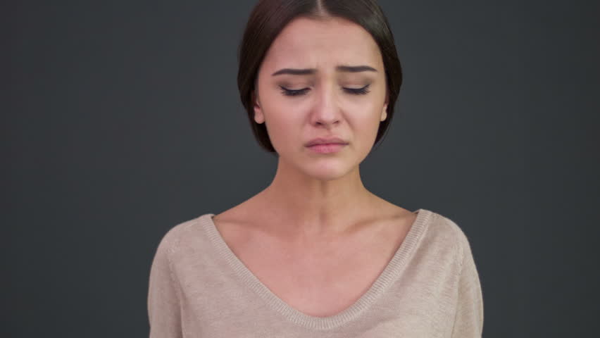 Emotional Person. Young Crying Woman Tries To Cry Less And Calm Down ...