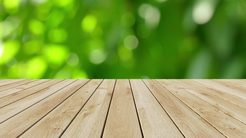 Wood Table Top On Blur Moving Natural Green Leaf ...