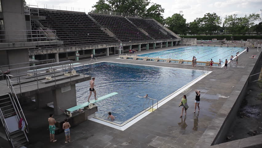 germany circa july 2015 man jumps off diving board at berlin olympic stadium pool - Olympic Swimming Pool 2015 germany circa july 2015 man jumps off diving board at berlin olympic stadium pool - Olympic Swimming Pool 2015