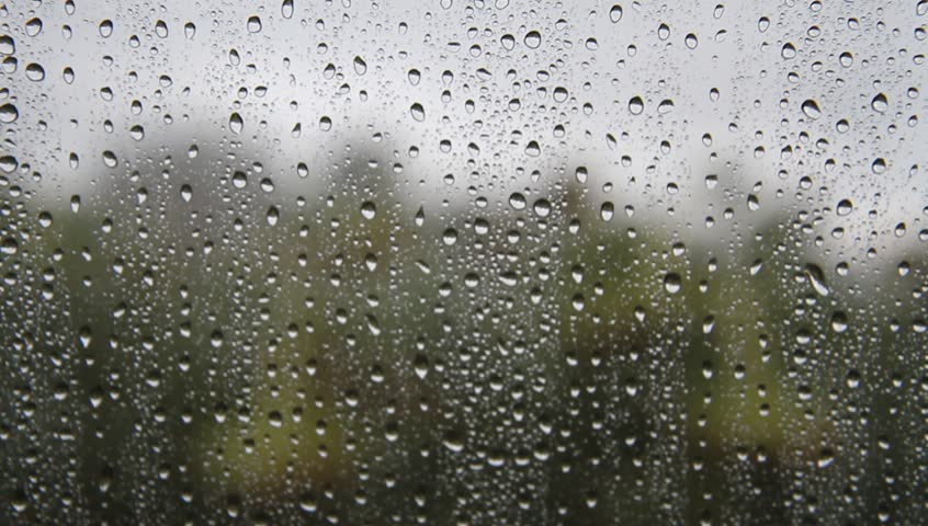 View Through A Rain-spattered Clear Tent Panel Of A Caravan And Awning ...