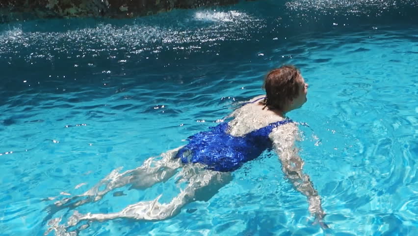 Active Girl Swimming In Blue Water On Pool Stock Footage 