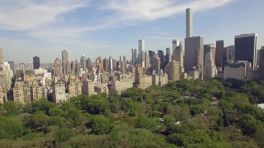 AERIAL ESTABLISHING SHOT: Flying Above Central Park Along 5th Avenue ...