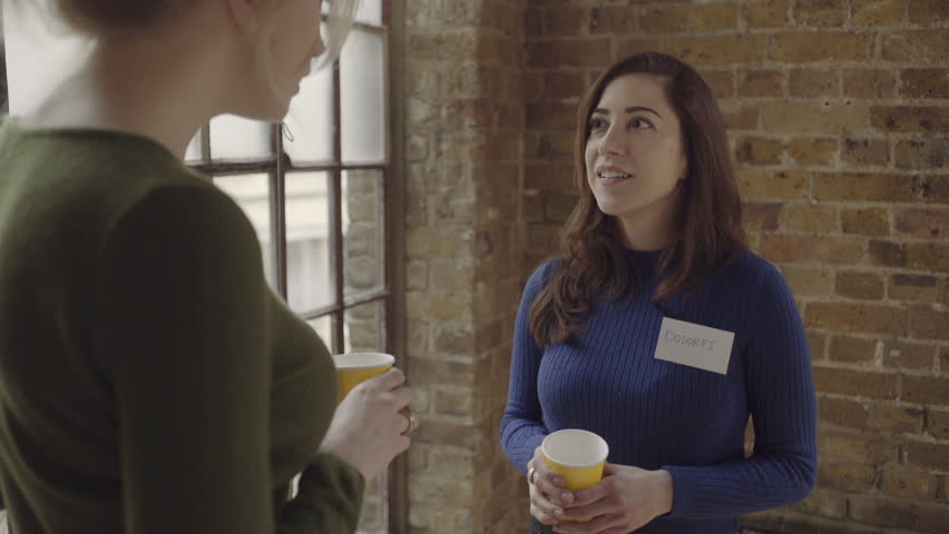 Two Adult Women Talking At Networking Event Two Adult Women Talking At Networking Event