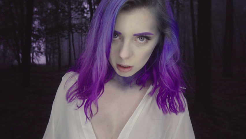 Closeup Of Beautiful Woman In White Shirt And Purple Hair Walking In