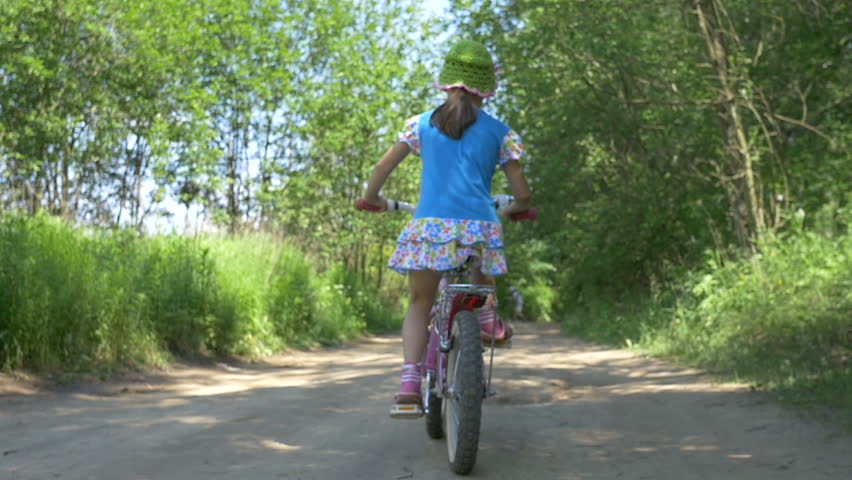 little girl on bicycle