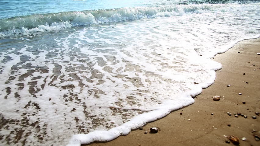 Water Washing Up On Shore Ocean Waves On Golden Brown 