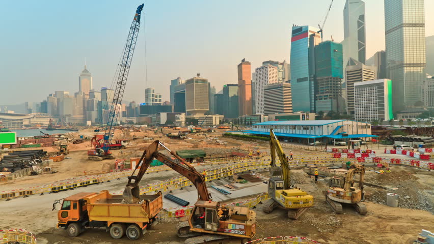 Construction Of Concrete Buildings On Background Moving Clouds In