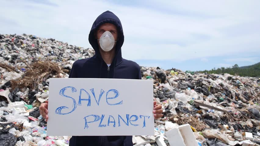 Serious Man In Mask Looking In Camera On In Landfill Site Pollution ...