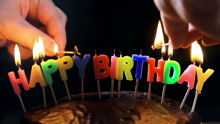 Lighted Candles On A Happy Birthday Cake Candles With The Words Happy