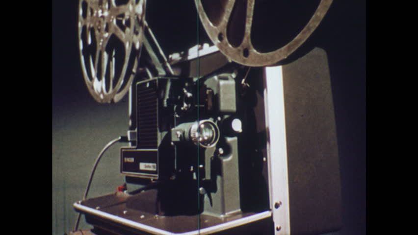 A Motion Picture Movie Projector Sends A Beam Of Light Into The Dark Stock Footage Video 906664