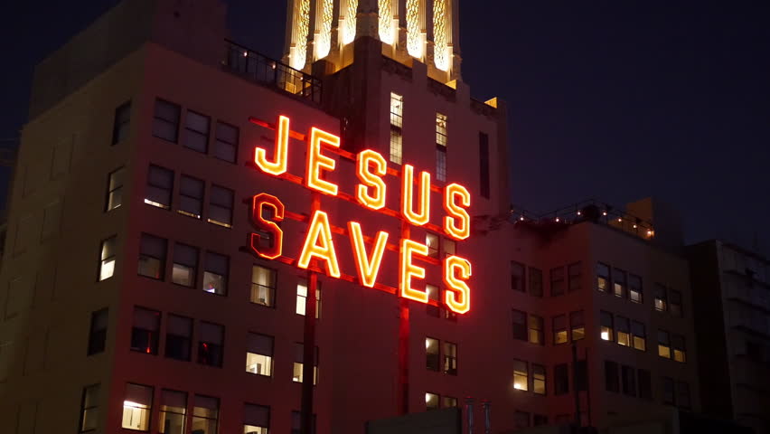 Rooftop Neon Jesus Saves Sign - Los Angeles - Circa August 2016 Stock