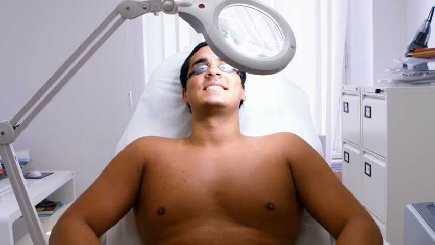 Male Patient Lying On Surgical Chair After Getting Waxed In Clinic 4k Male Patient Lying On Surgical Chair After Getting Waxed In Clinic 4k