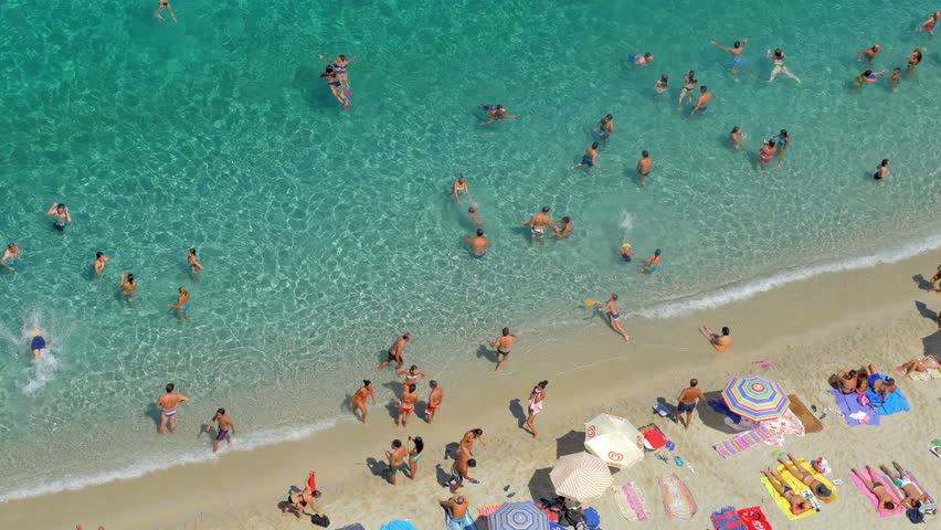 People On The Beach, Sunbathing And Swimming, Enjoying On Vacation ...