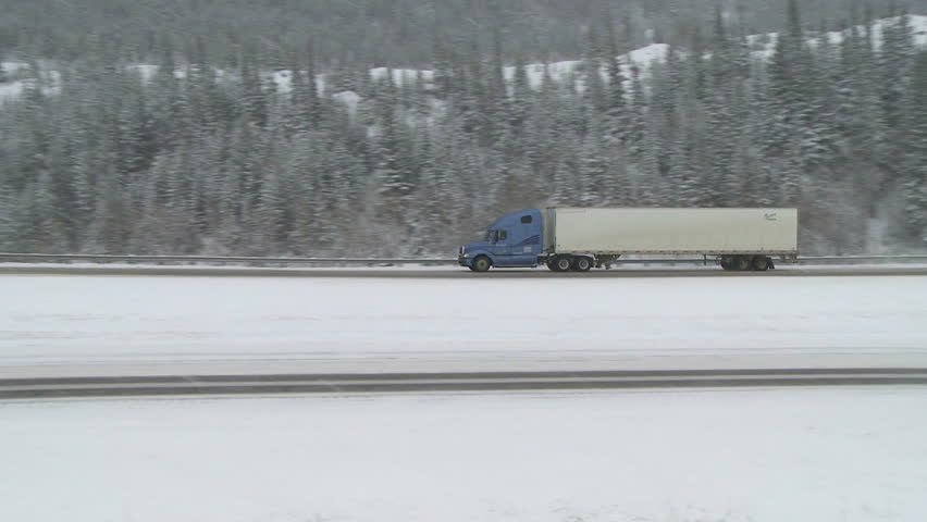 Reveal, Rolled Semi Truck In Ditch, Winter Snow Storm Stock Footage ...