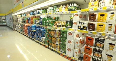 MONTREAL, CANADA - NOVEMBER 2016: Smooth & steady shot of beer alcohol variety in supermarket