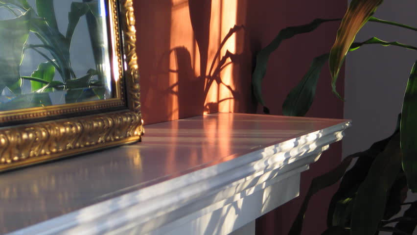 Time Lapse Of Sunlight Moving Over Fireplace Mantel