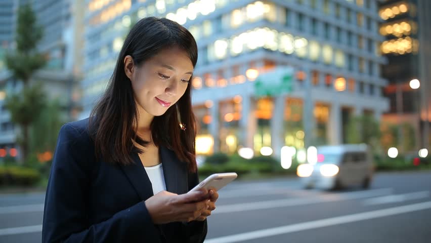 Person looking down at mobile phone technology