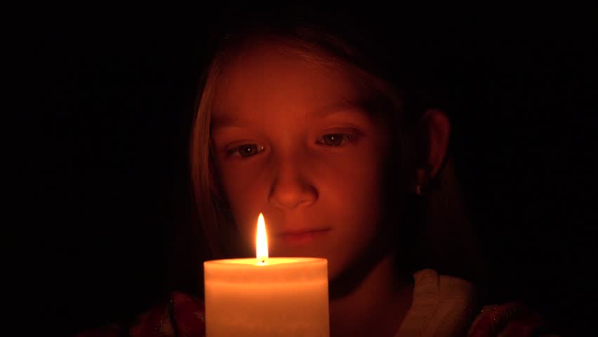 A Woman Sitting Alone At A Table With Candles Drinking A Glass Of Wine ...