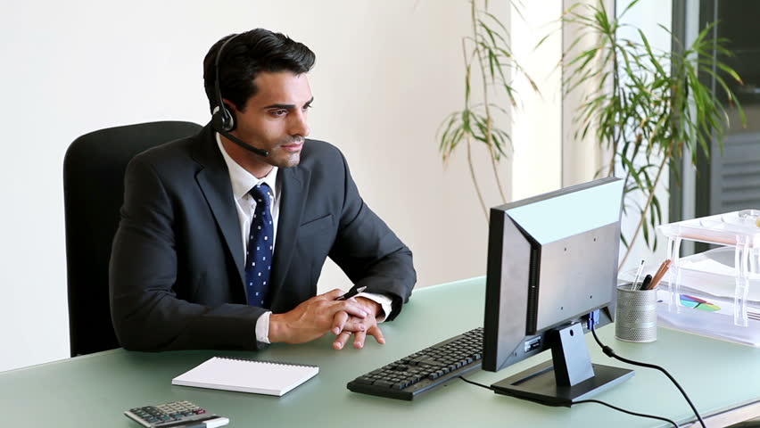 Businessman Having A Phone Call At His Desk Stock Footage Video Businessman Talking On His Headset In Office Hd Stock Video Clip