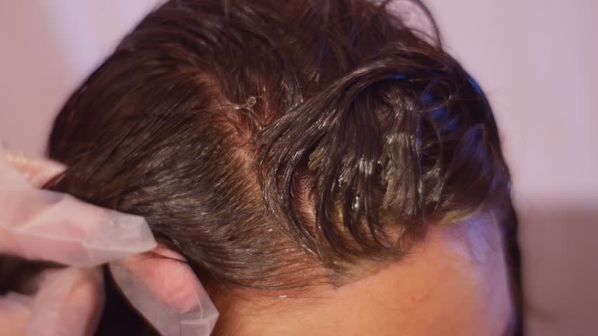 Non Professional Applies Dye With Brush Stock Footage Video 100