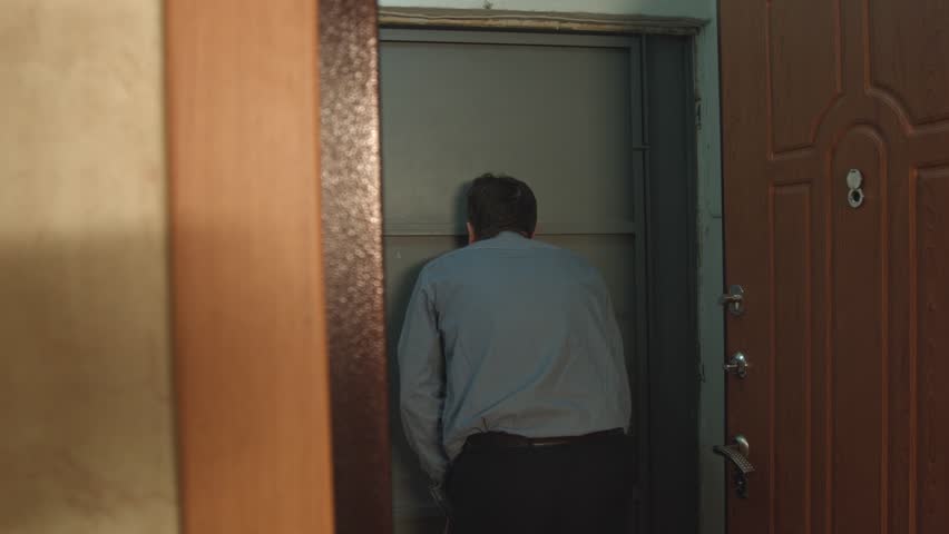 Packet Transmission From Hand To Stock Footage 100 Royalty Packet Transmission From Hand To At The Front Door A Man Of Age Is Coming Looking Through Phole He Opens