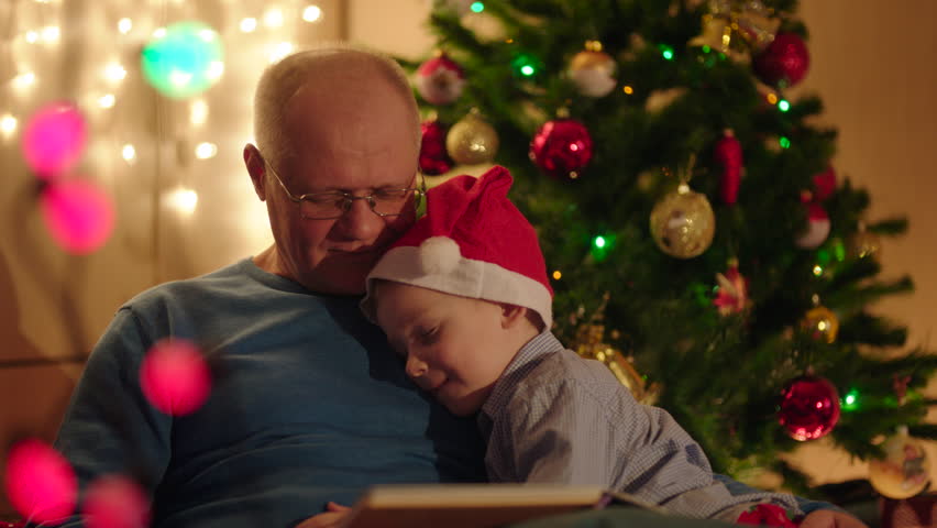 4k0008little boy felling asleep during his gradpa reading book to him on christmas eve - Grandpa For Christmas 4k0008little boy felling asleep during his gradpa reading book to him on christmas eve - Grandpa For Christmas