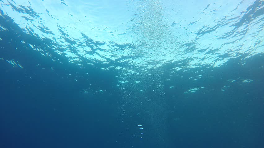 Under Water Air Bubbles Rising From Deep Water Up To The Surface. Stock ...