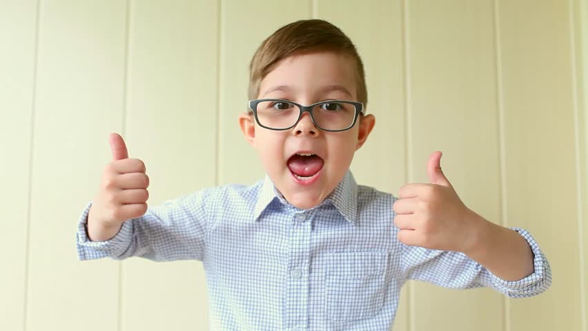 Hd00 07a Child With Glasses Gives A Thumbs Up A Kid Likes The Glasses